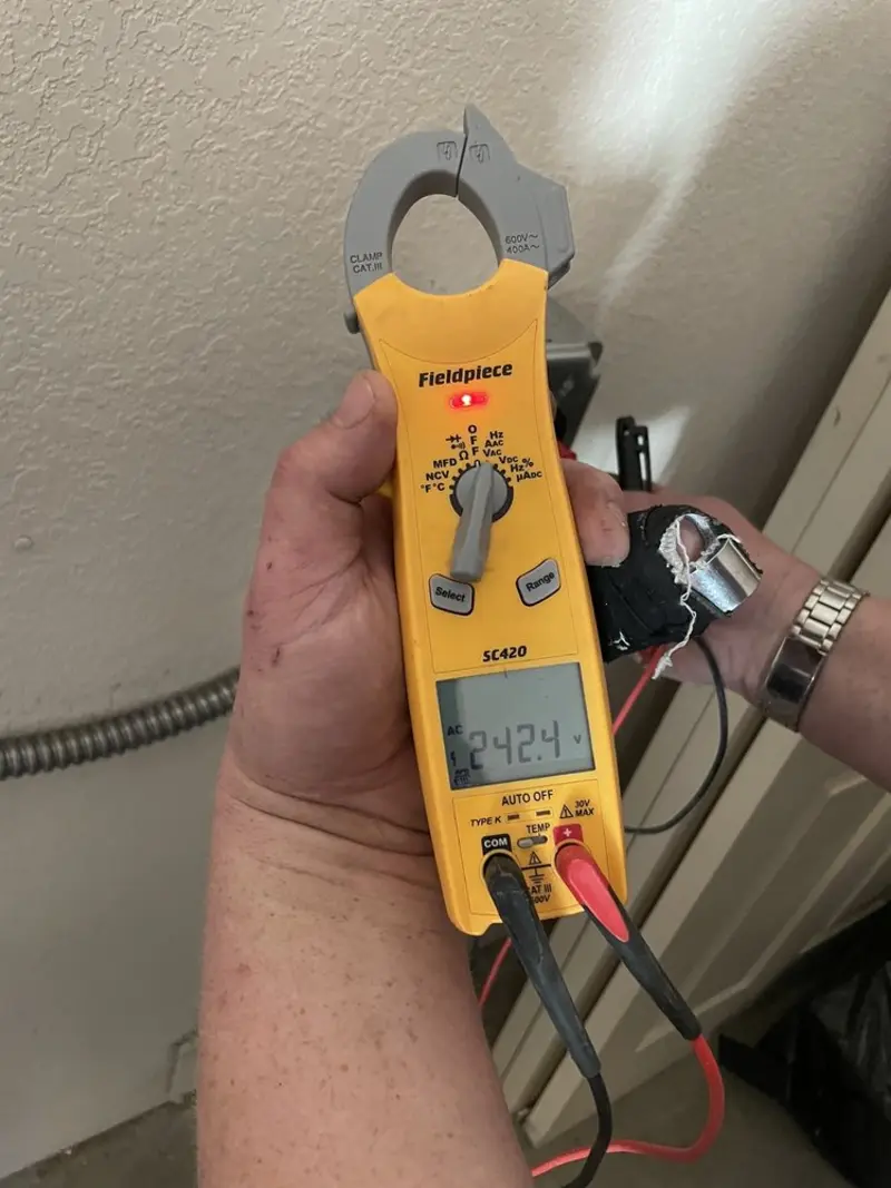 Voltage testing with clamp meter during Outlet Installation in Selbyville